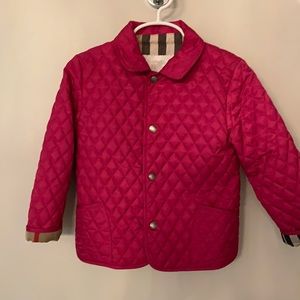Magenta pink Burberry jacket.